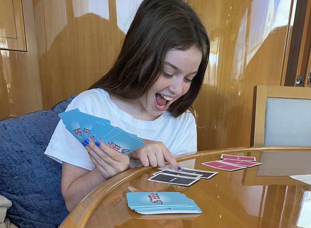 young girl playing go-fish triple tongue twister